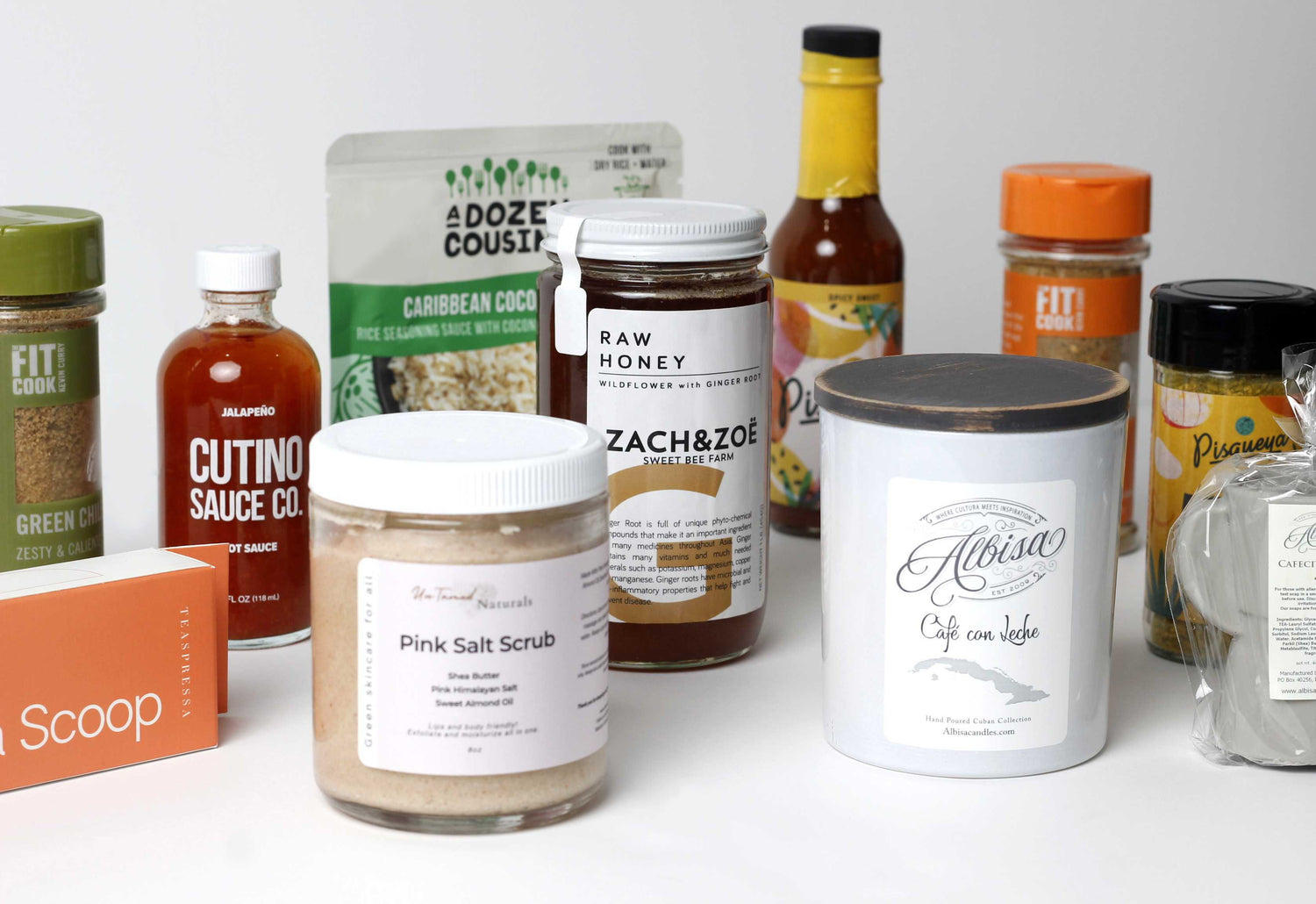 Assorted products including jars, bottles, and boxes on a white surface
